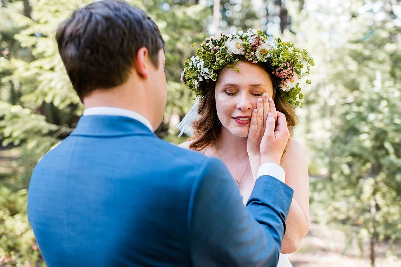 emotional bride in wildflower flower crown at Evergreen Red Barn Wedding by Golden wedding photographer Jennie Crate