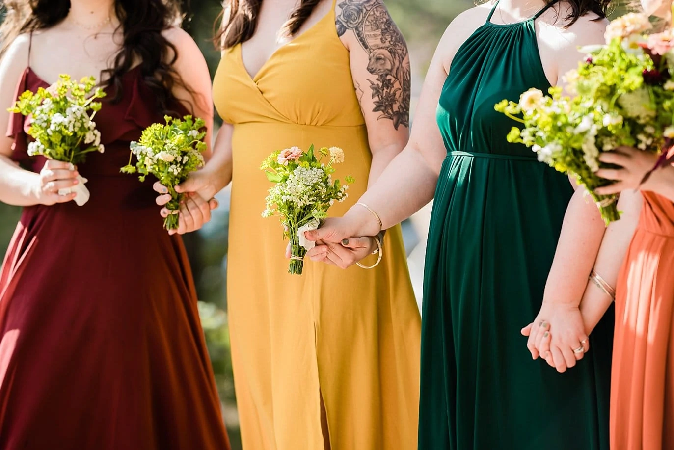 bridesmaids holding hands during intimate wedding ceremony photo