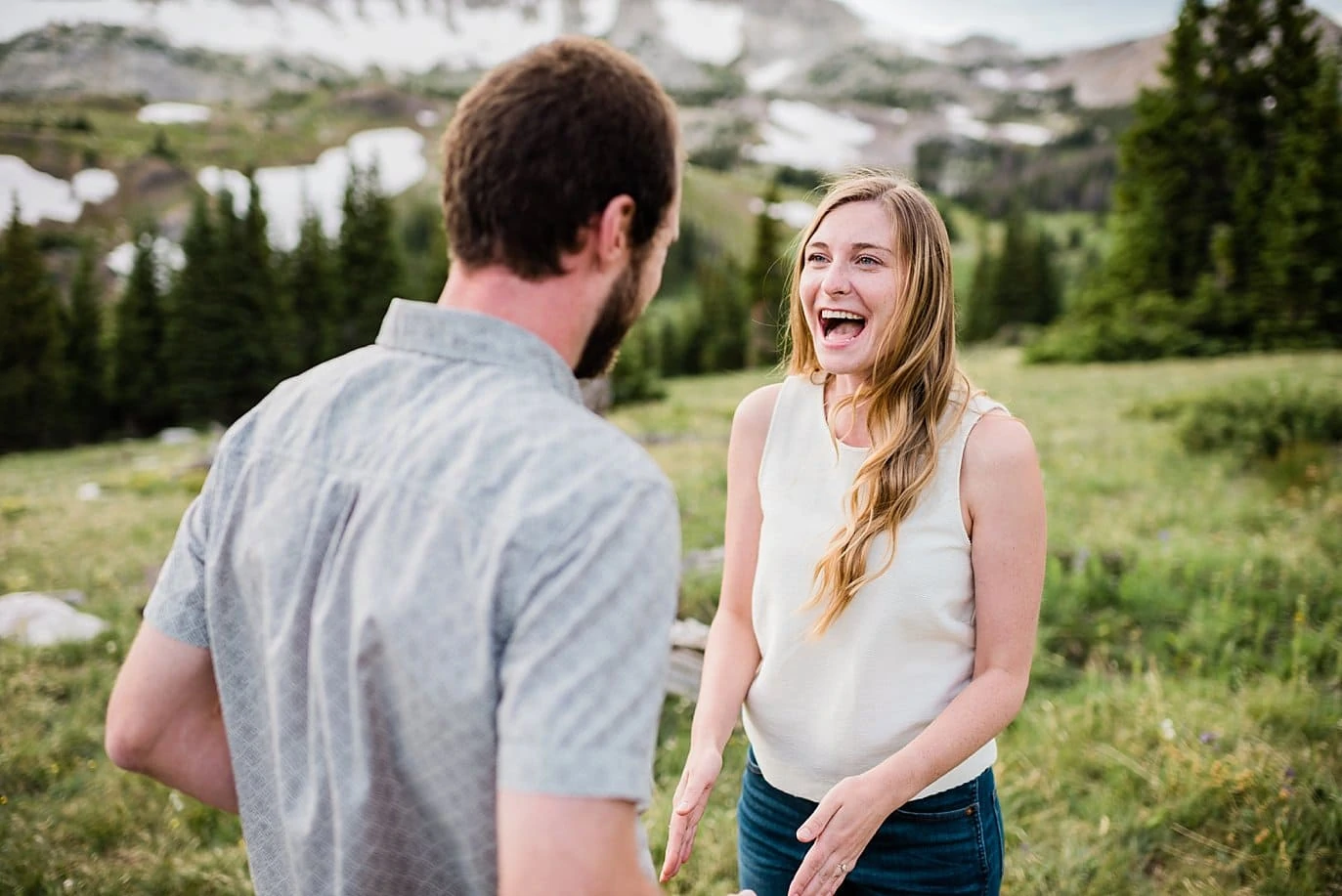 laughing outdoor engagement by Wyoming engagement photographer Jennie Crate
