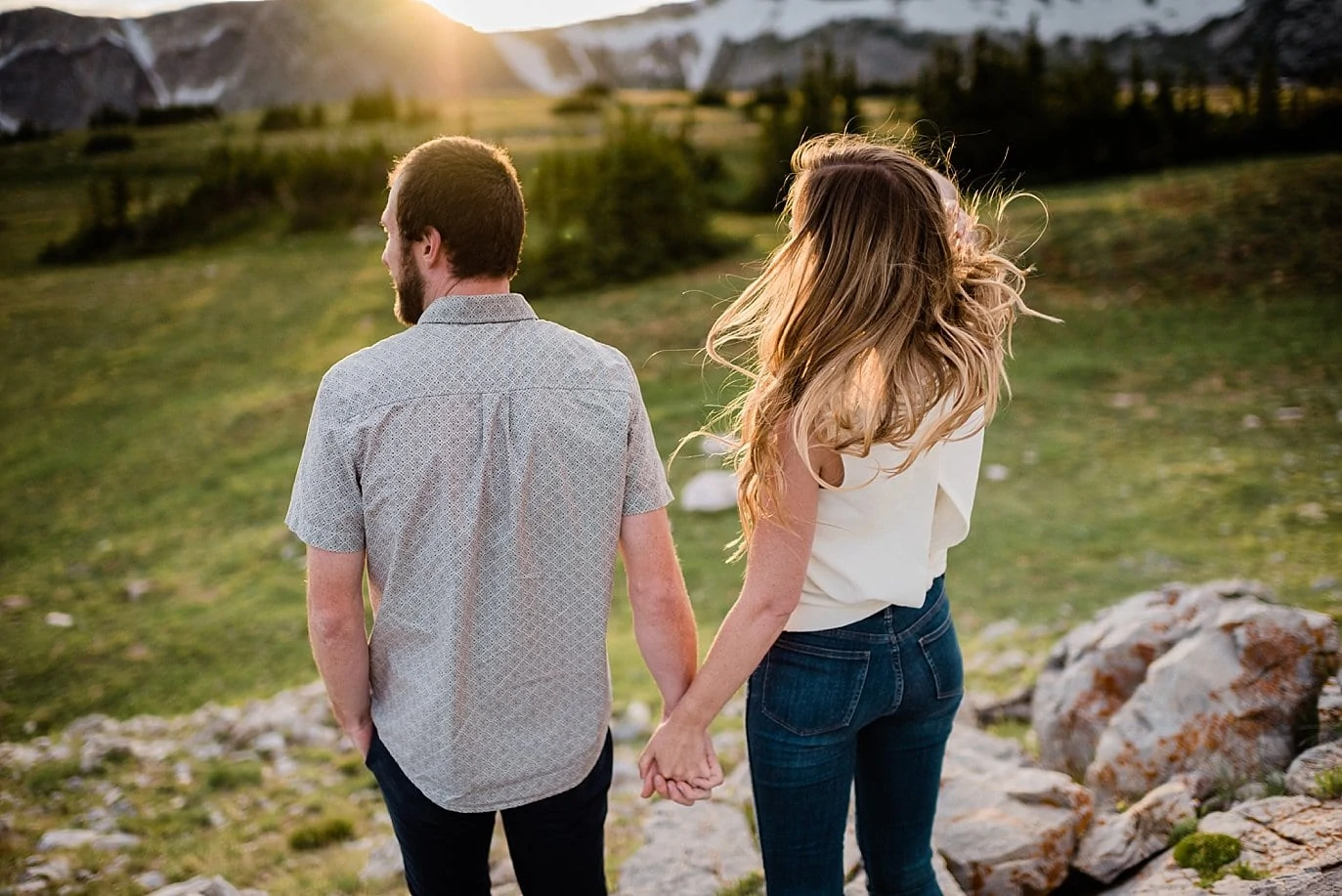 sunset wind in hair during engagement photo