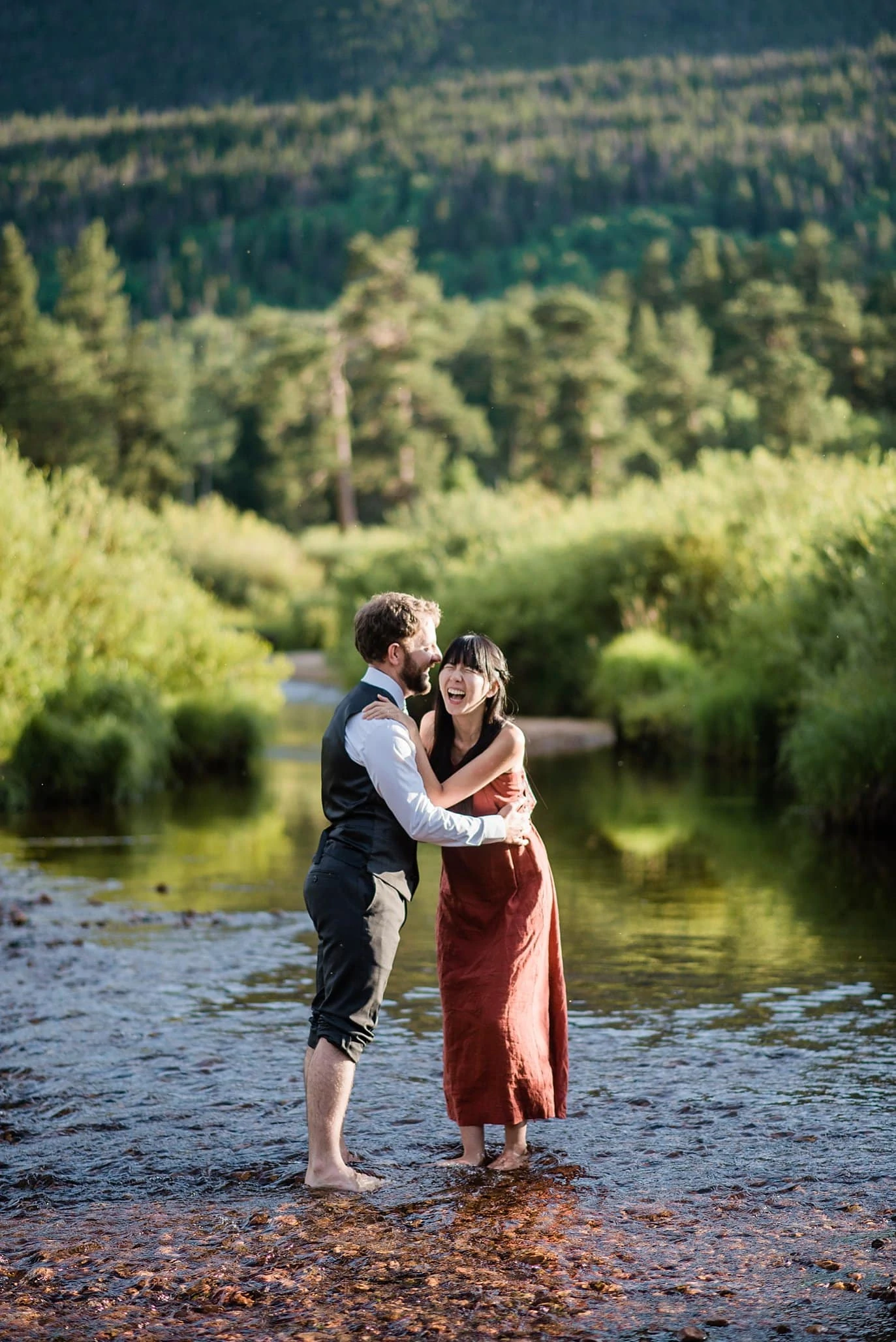 couple in river in Rocky Mountain National Park photo
