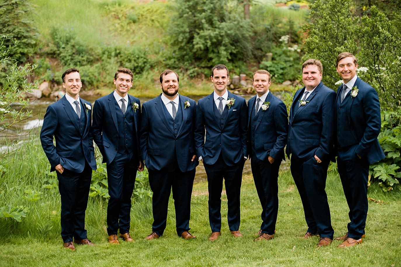 Groom and Groomsmen outdoor Vail wedding by Vail wedding photographer Jennie Crate