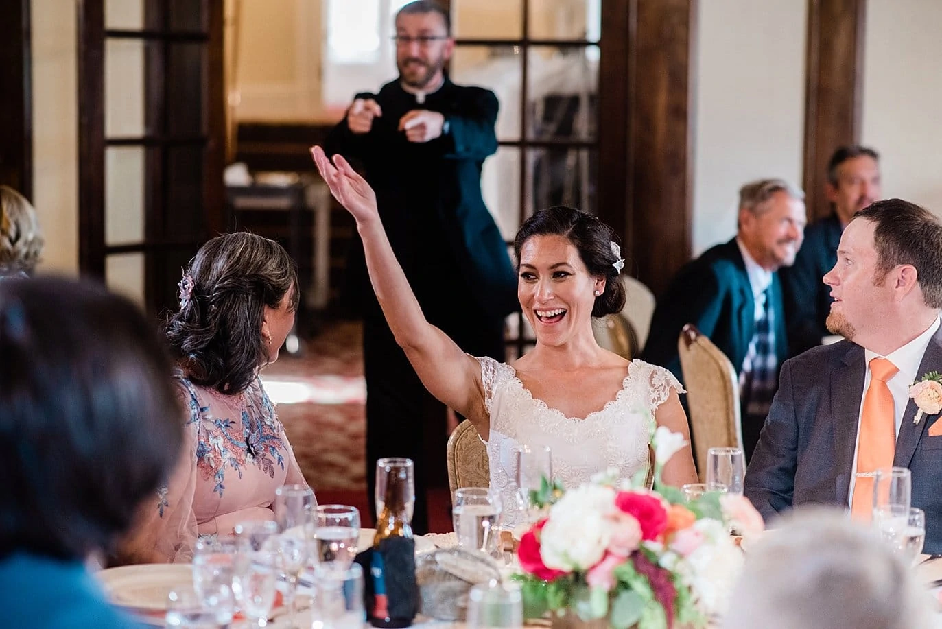 toasts at dinner at The Stanley Hotel wedding by longmont wedding photographer Jennie Crate