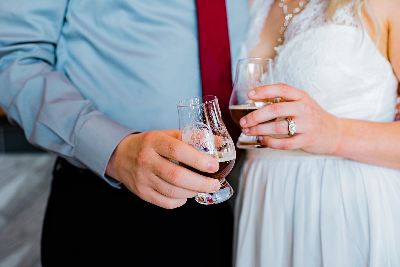 bride and groom toast at bar at Northgate Event Center wedding by Westminster wedding photographer Jennie Crate