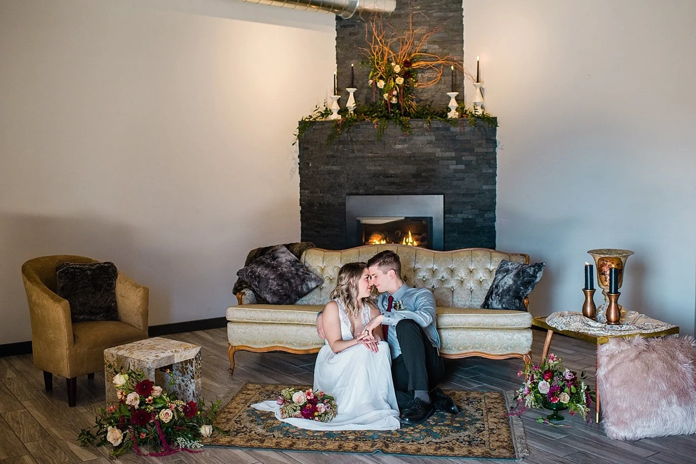 bride and groom in cozy lounge area at Northgate Event Center wedding by Denver wedding photographer Jennie Crate