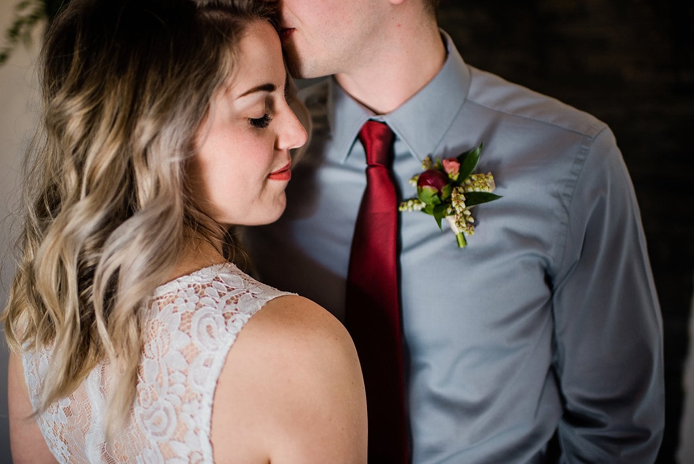 intimate moment between bride and groom at at winter Northgate Event Center wedding by Denver wedding photographer Jennie Crate