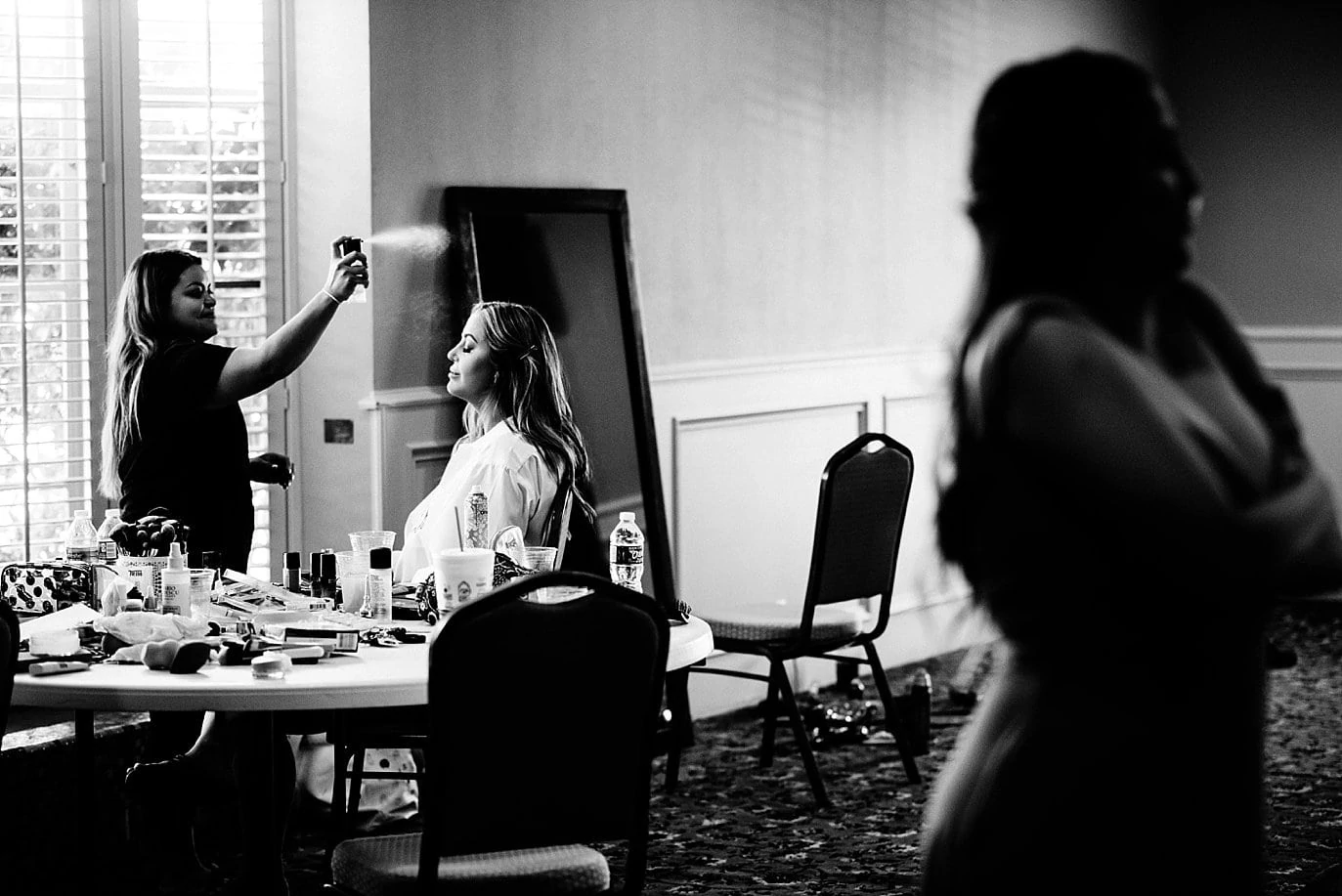 bride getting hair and make up done at The Forum Wichita Falls Texas wedding by Dallas wedding photographer Jennie Crate