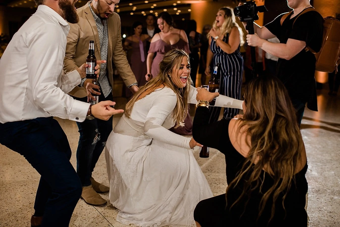 bride at reception dance party at The Forum Wichita Falls wedding by Texas wedding photographer Jennie Crate
