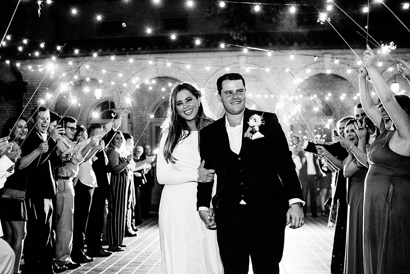 bride and groom sparkler exit at The Forum Wichita Falls wedding by Austin wedding photographer Jennie Crate
