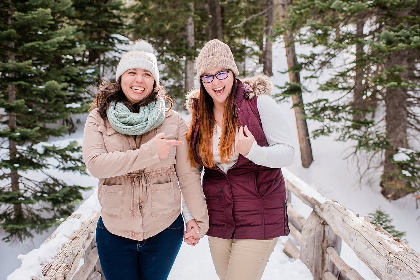 couple playing fun engagement session games Alberta Falls Rocky Mountain National Park winter hiking engagement by Fort Collins engagement photographer Jennie Crate, Photographer