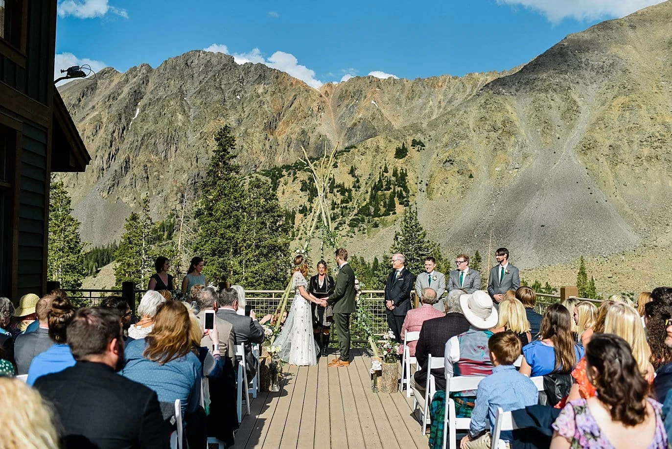 bride and groom outdoor ceremony at Black Mountain Lodge at Arapahoe Basin wedding by Black Mountain Lodge wedding photographer