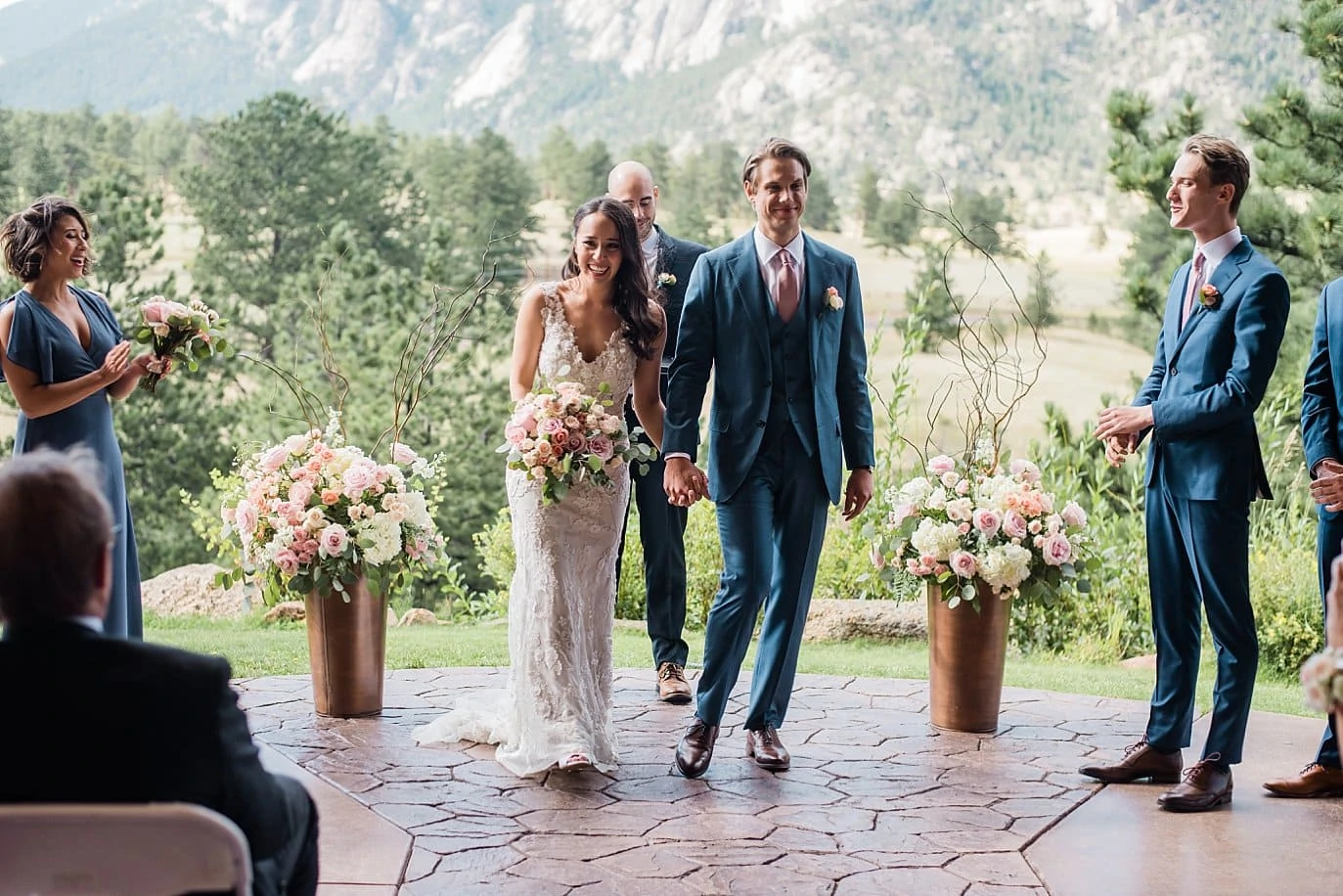 bride and groom walk back down the aisle as husband and wife at at Black Canyon Inn wedding by Denver Wedding photographer Jennie Crate photographer