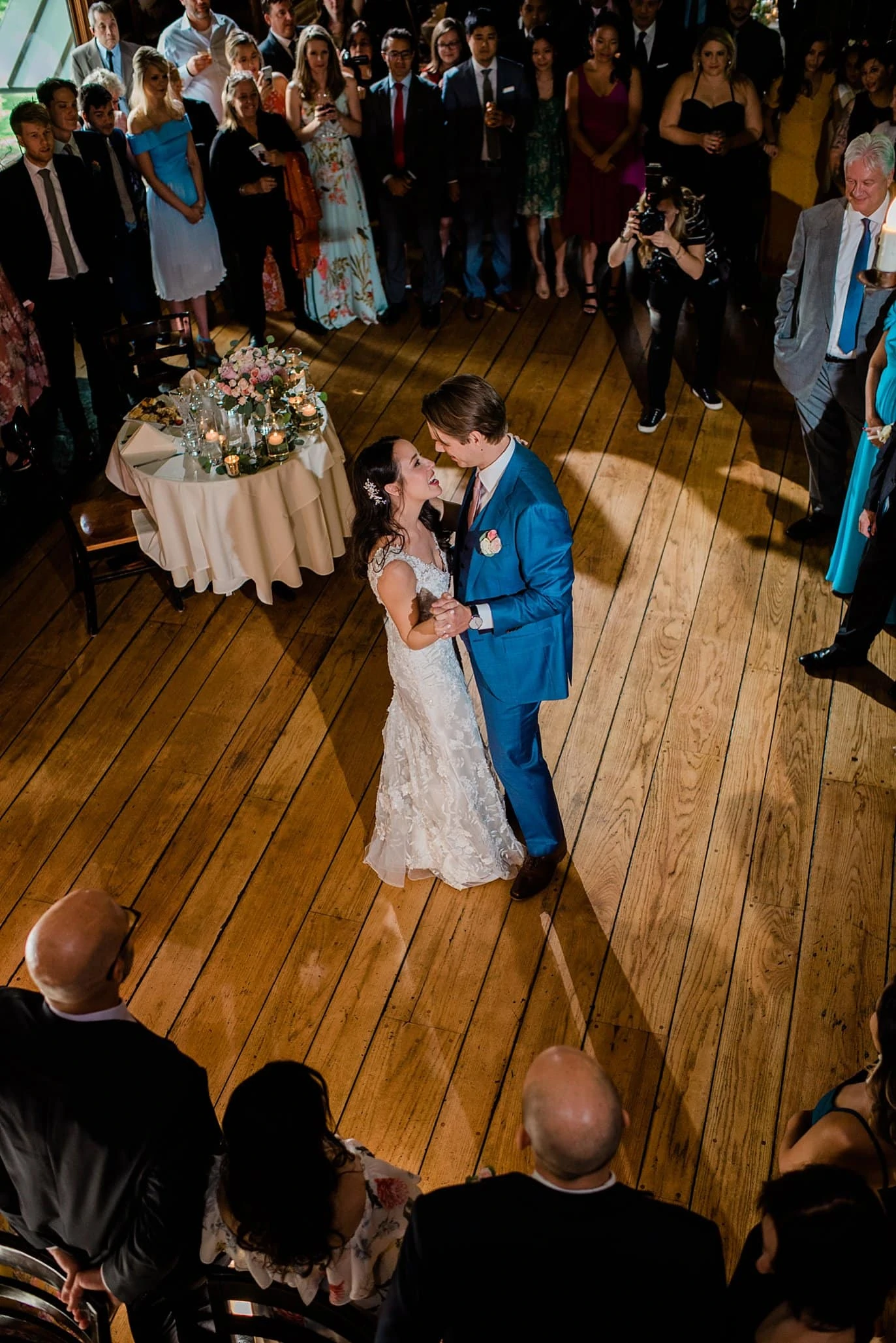bride and groom first dance photo from above at t Twin Owls Steakhouse wedding by Estes Park wedding photographer Jennie Crate photographer
