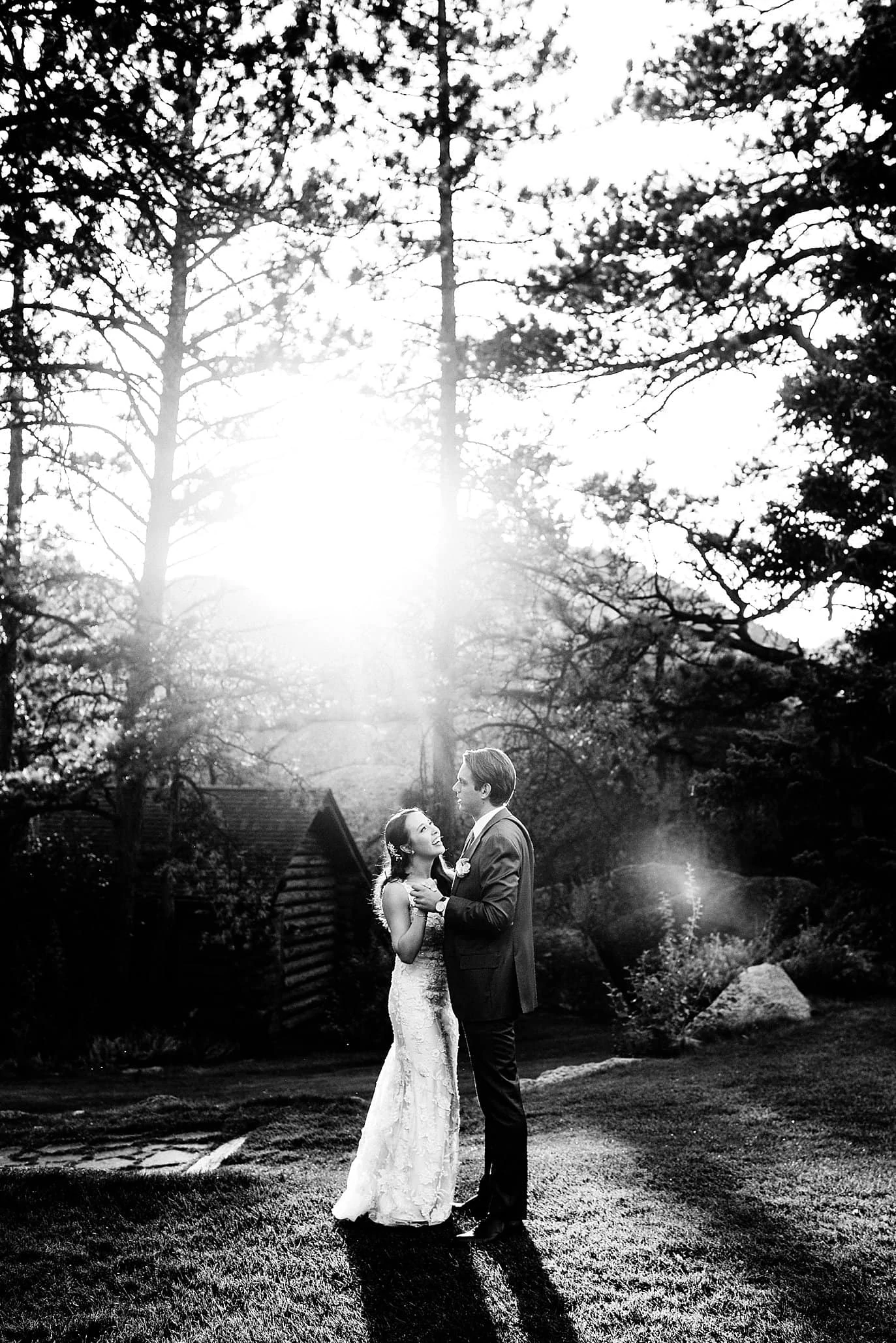 bride and groom romantic sunset portrait at t Twin Owls Steakhouse wedding by Estes Park wedding photographer Jennie Crate photographer