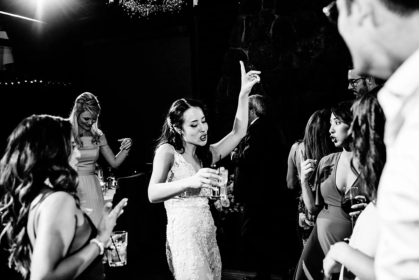 bride dancing on dance floor at Black Canyon Inn and Twin Owls Steakhouse wedding by Estes Park wedding photographer Jennie Crate