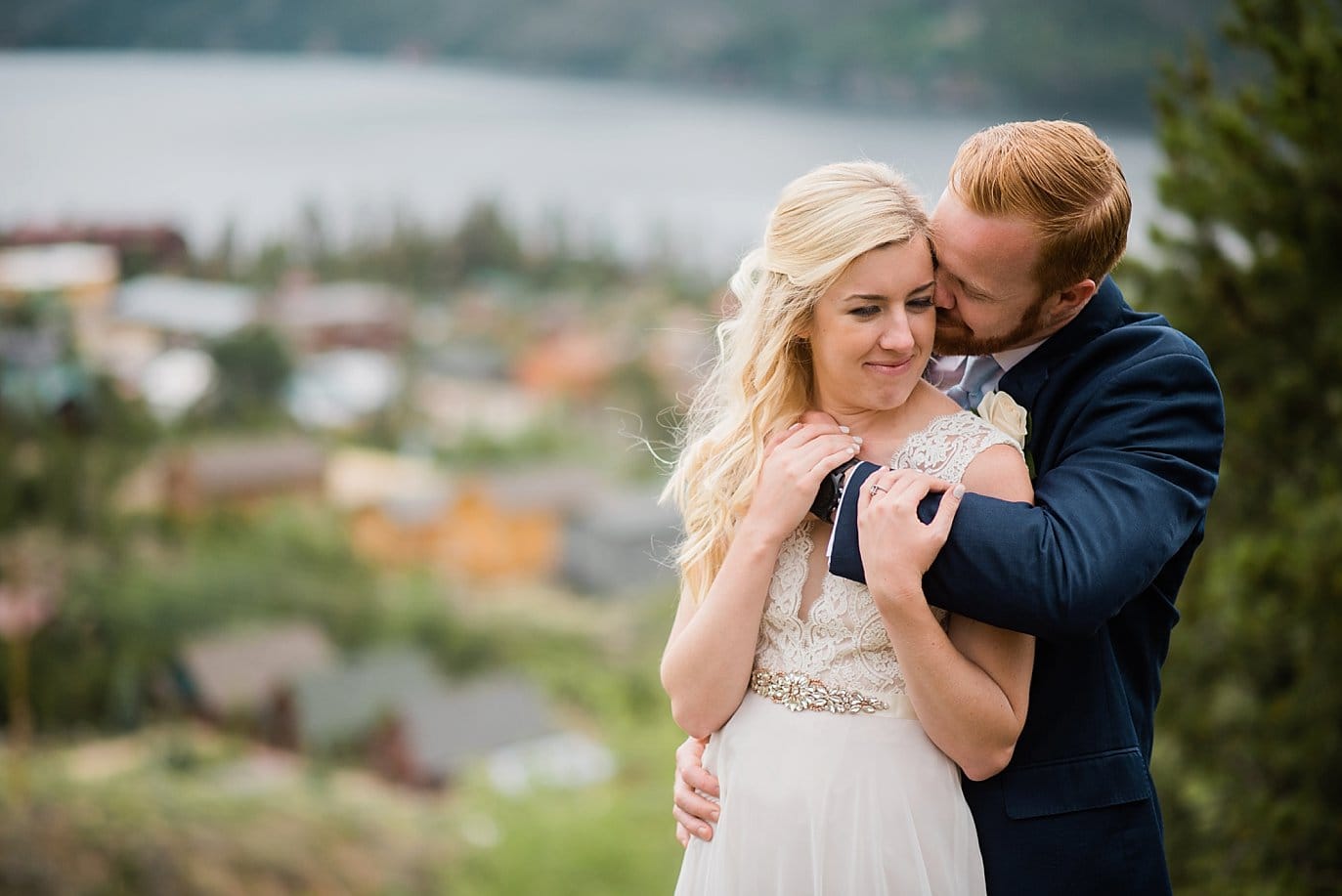 bride and groom romantic portrait in front of Grand Lake Lodge views at Grand Lake Lodge wedding byGranby wedding photographer Jennie Crate