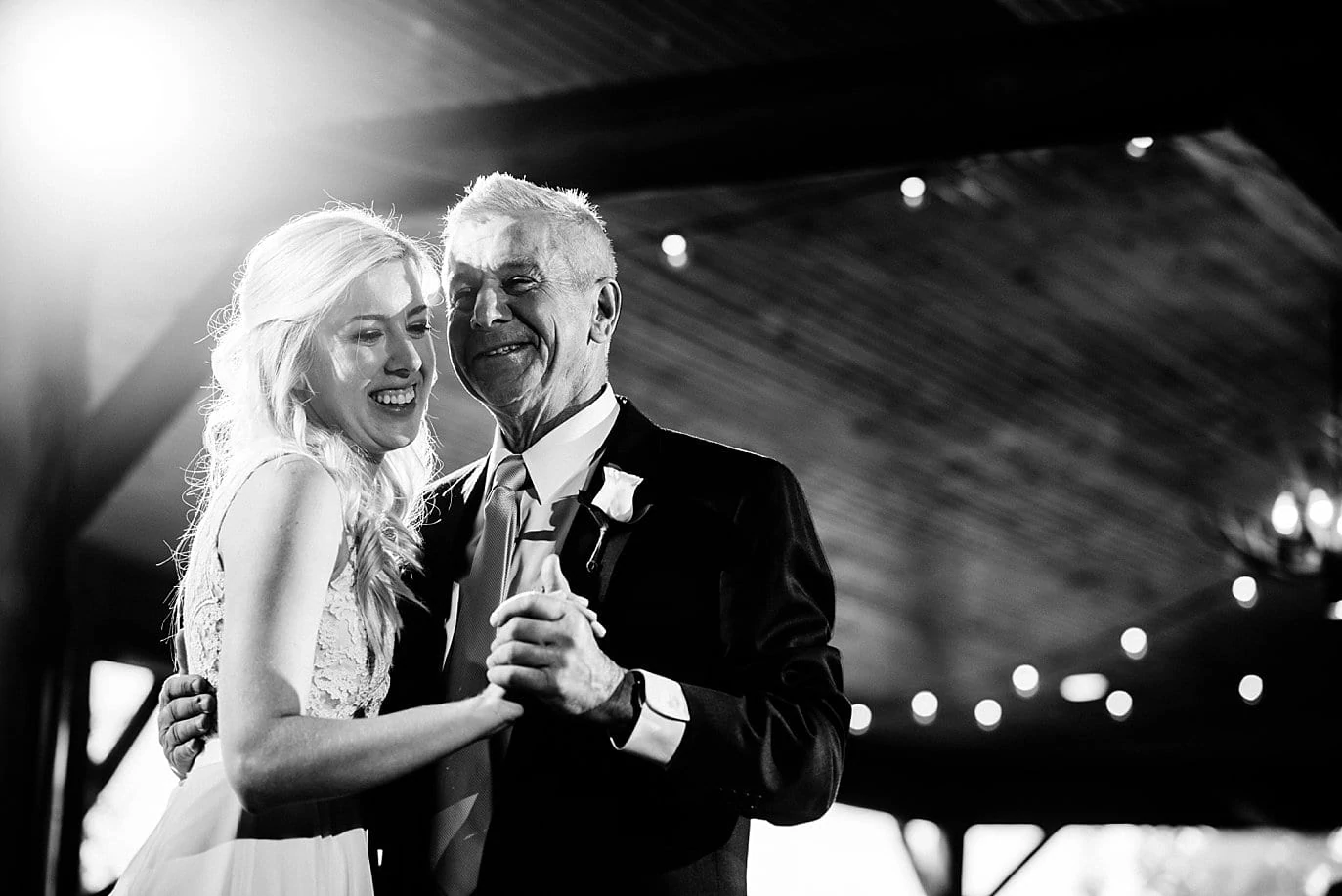 bride and dad father daughter dance at Grand Lake Lodge wedding by Winter Park wedding photographer Jennie Crate Photographer