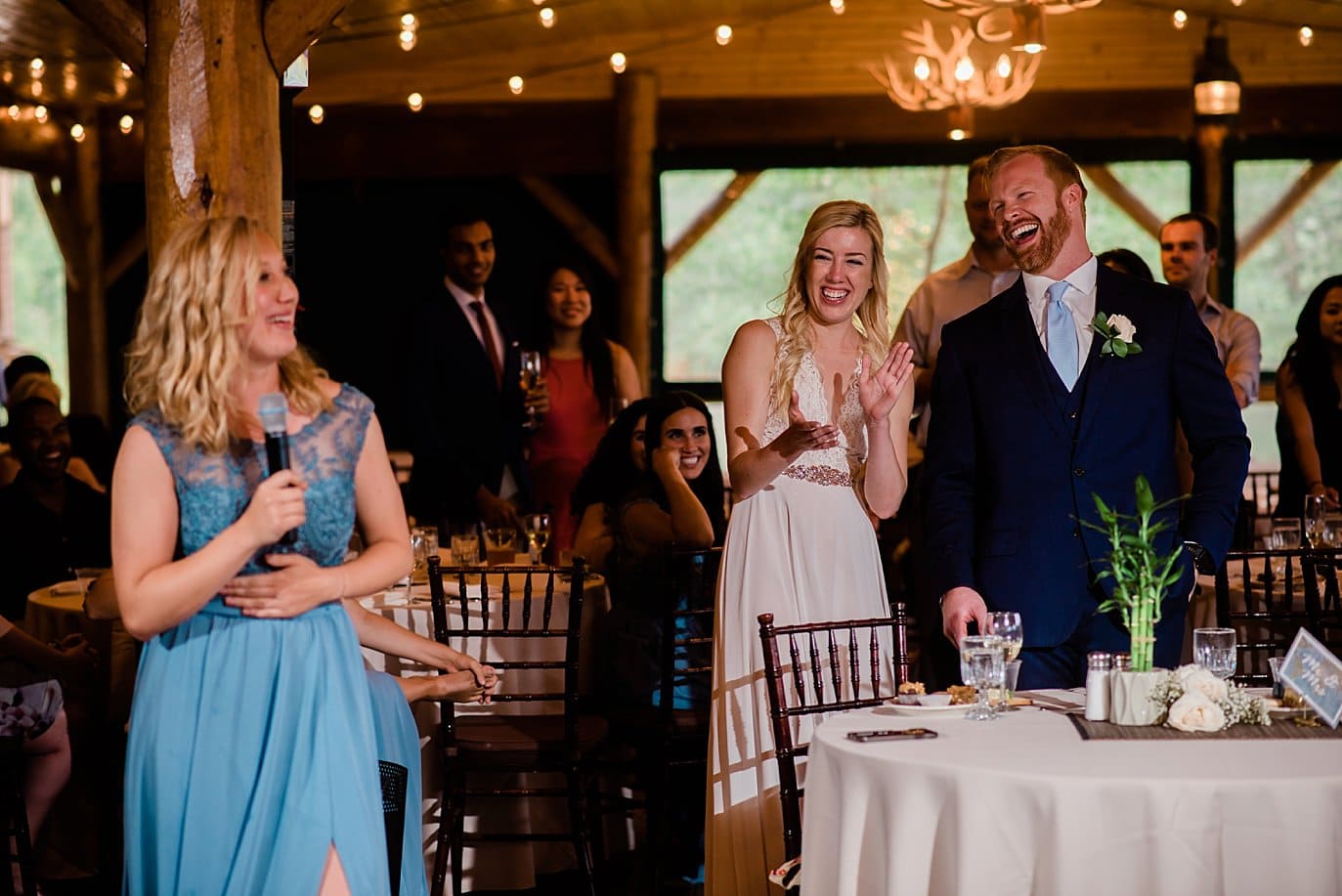 bride's sister roasts bride and groom at Grand Lake Lodge wedding reception by Tabernash wedding photographer Jennie Crate Photographer