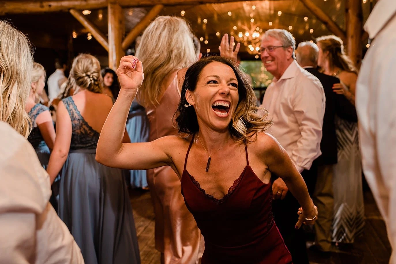 guest celebrate with wild dances at Grand Lake Lodge wedding by Winter Park wedding photographer Jennie Crate Photographer