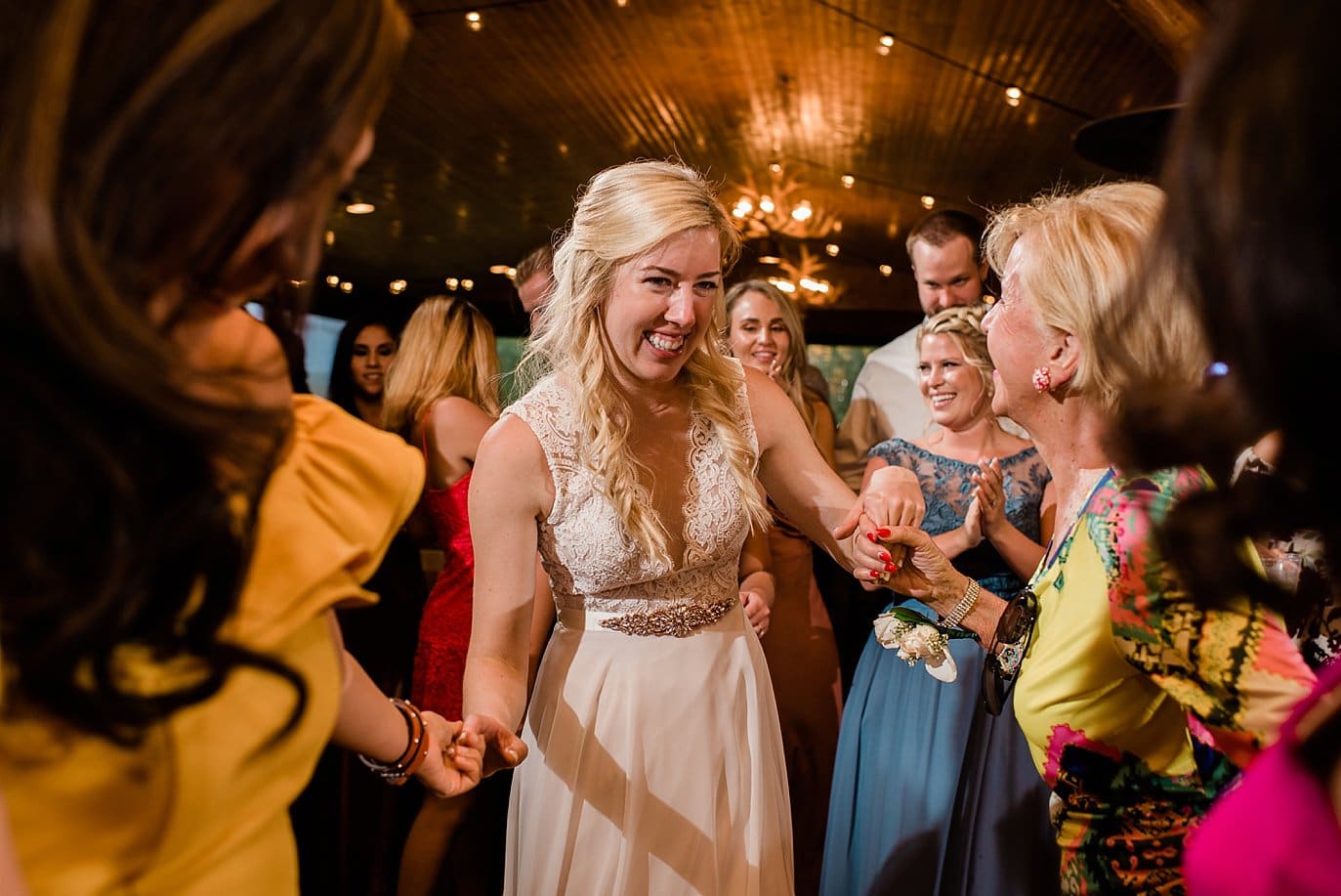 bride dancing with wedding guests at Grand Lake Lodge wedding by Grand Lake wedding photographer Jennie Crate Photographer