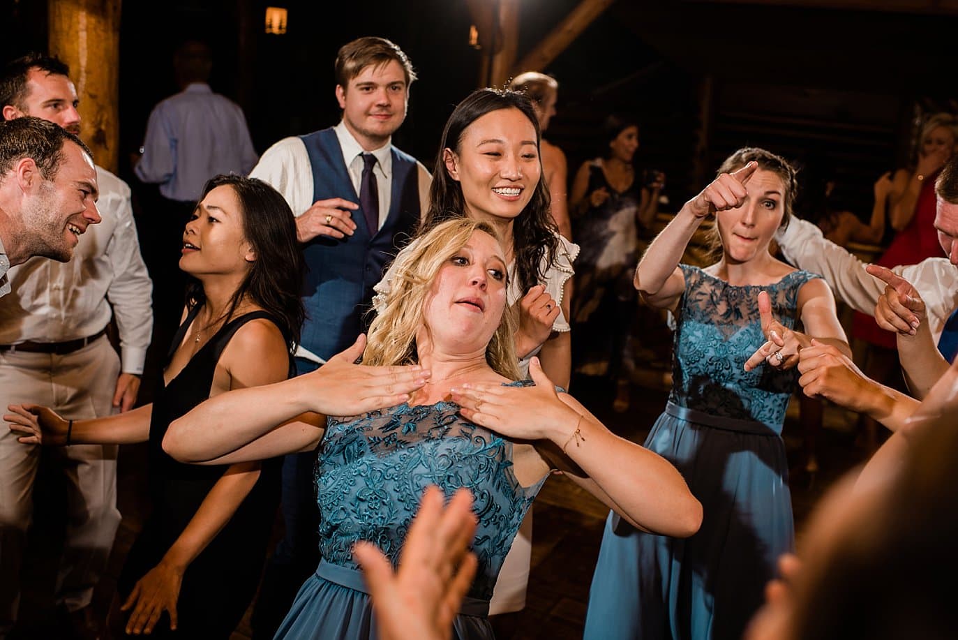 guest and bridal party dancing during wedding reception at Grand Lake Lodge wedding by Grand Lake wedding photographer Jennie Crate Photographer