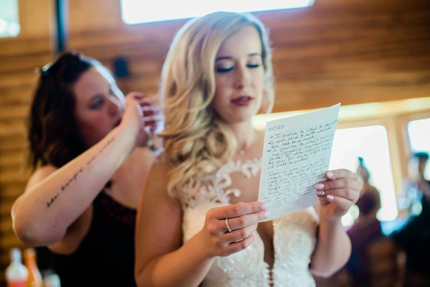 bride reads vows while getting hair fixed before wedding at Pagosa Springs wedding by Pagosa Springs Wedding Photographer Jennie Crate