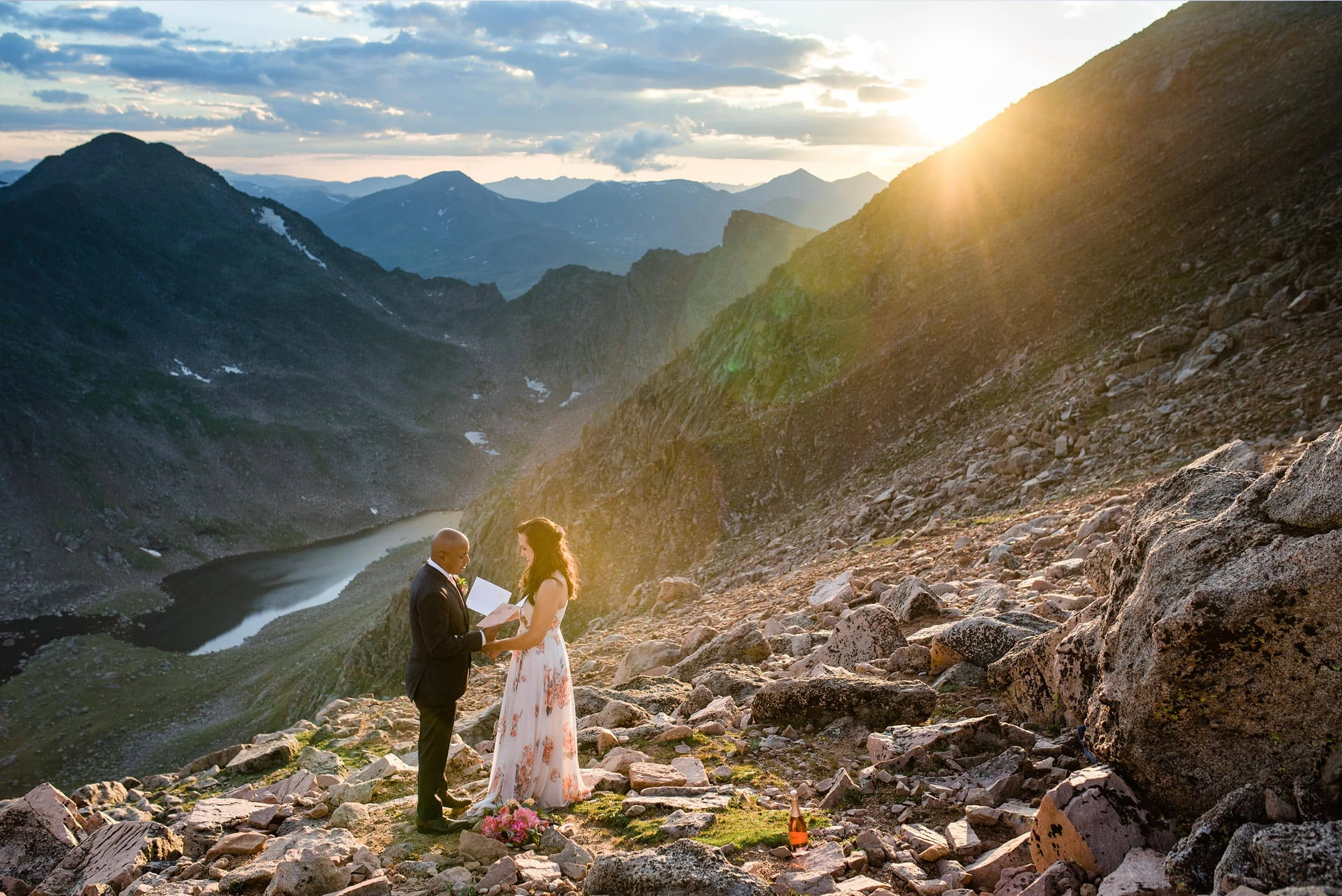 bride and groom say vows on top of Mt. Evans at Colorado elopement by Denver Wedding Photographer Jennie Crate Photographer