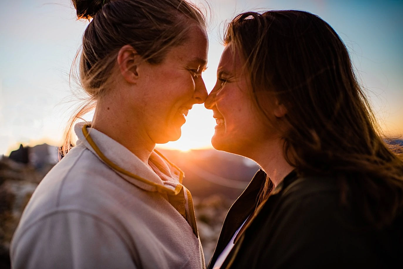 intimate LGBTQ sunset portrait at Rocky Mountain National Park engagement session by Colorado Gay Wedding photographer Jennie Crate