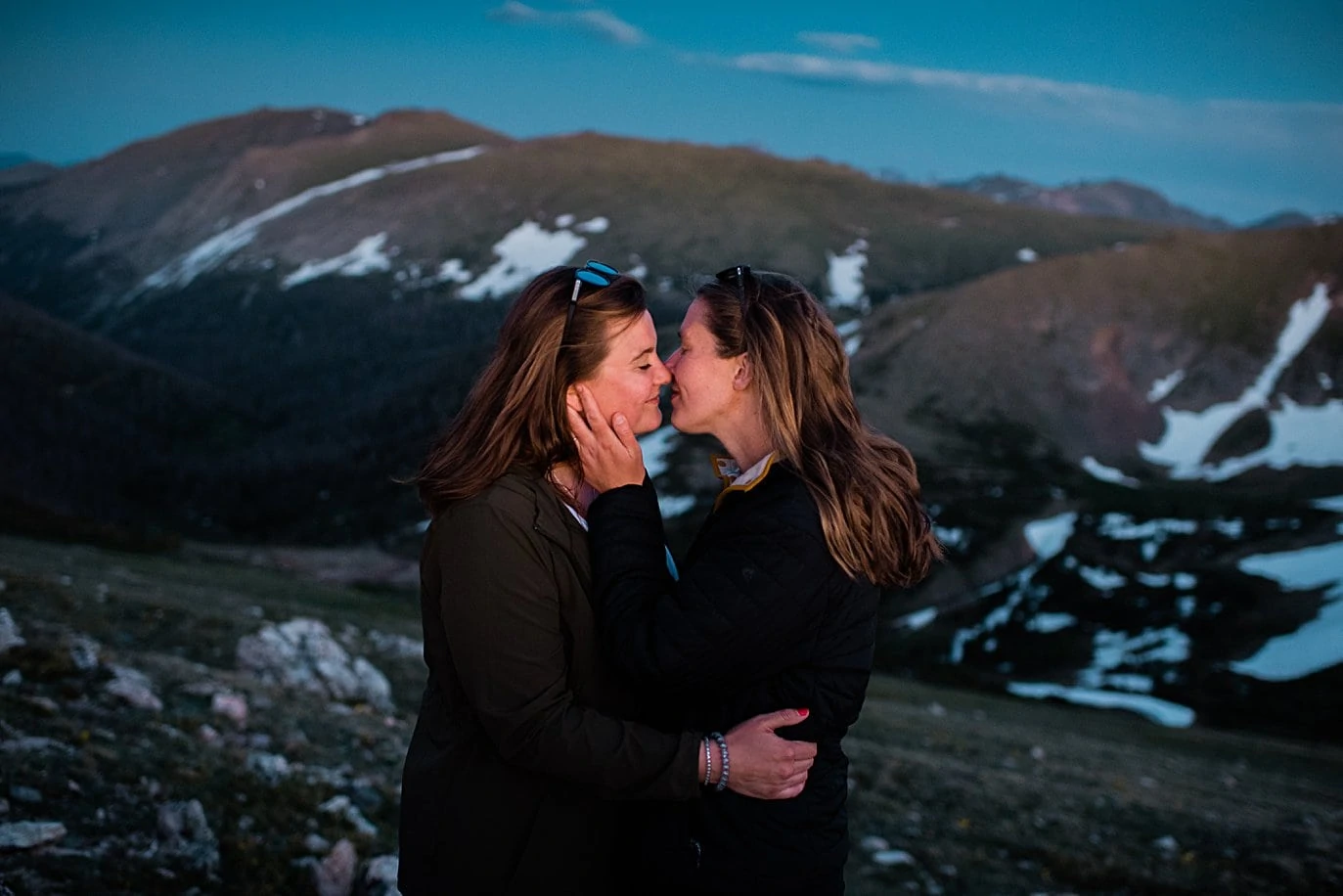 couple kisses at sunset on top of trail ridge road by Colorado LGBT wedding photographer Jennie Crate