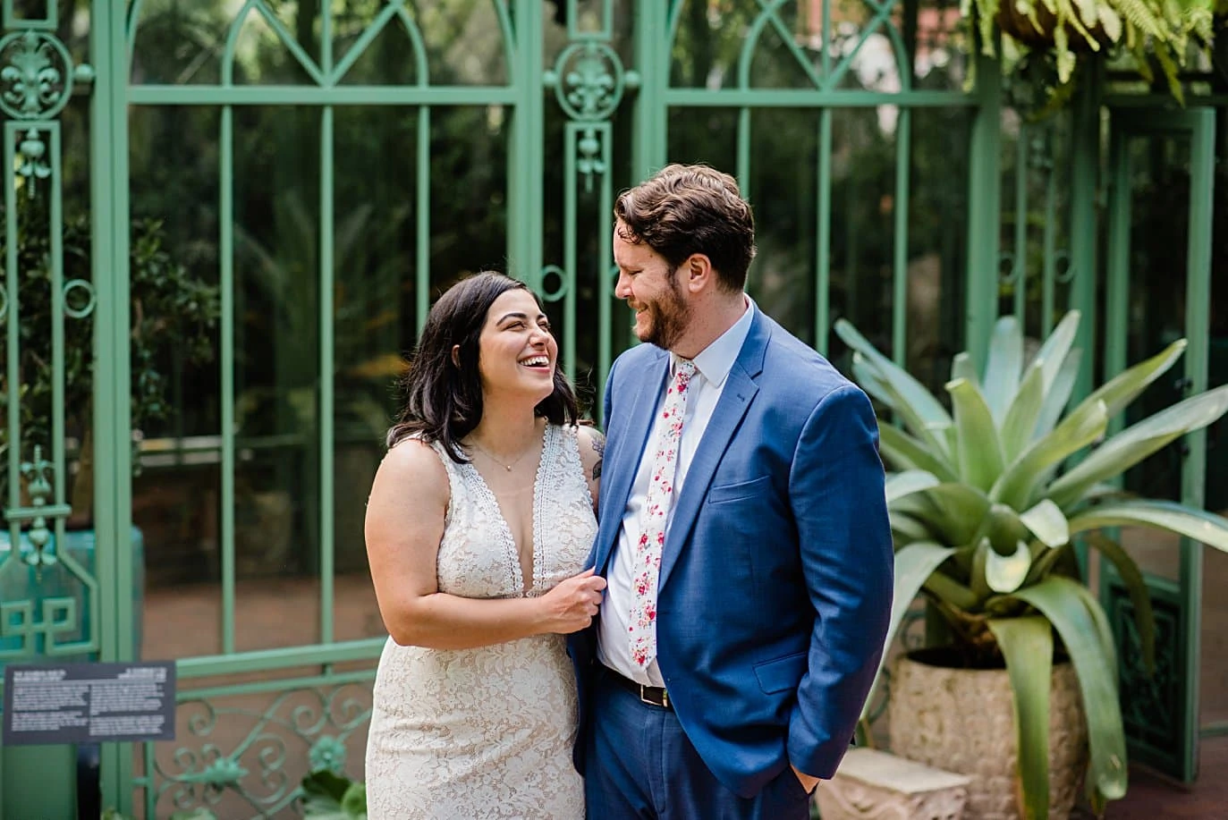 bride and groom in front of Woodland Mosaic wedding ceremony location at Denver Botanic Gardens wedding by Denver Wedding Photographer Jennie Crate