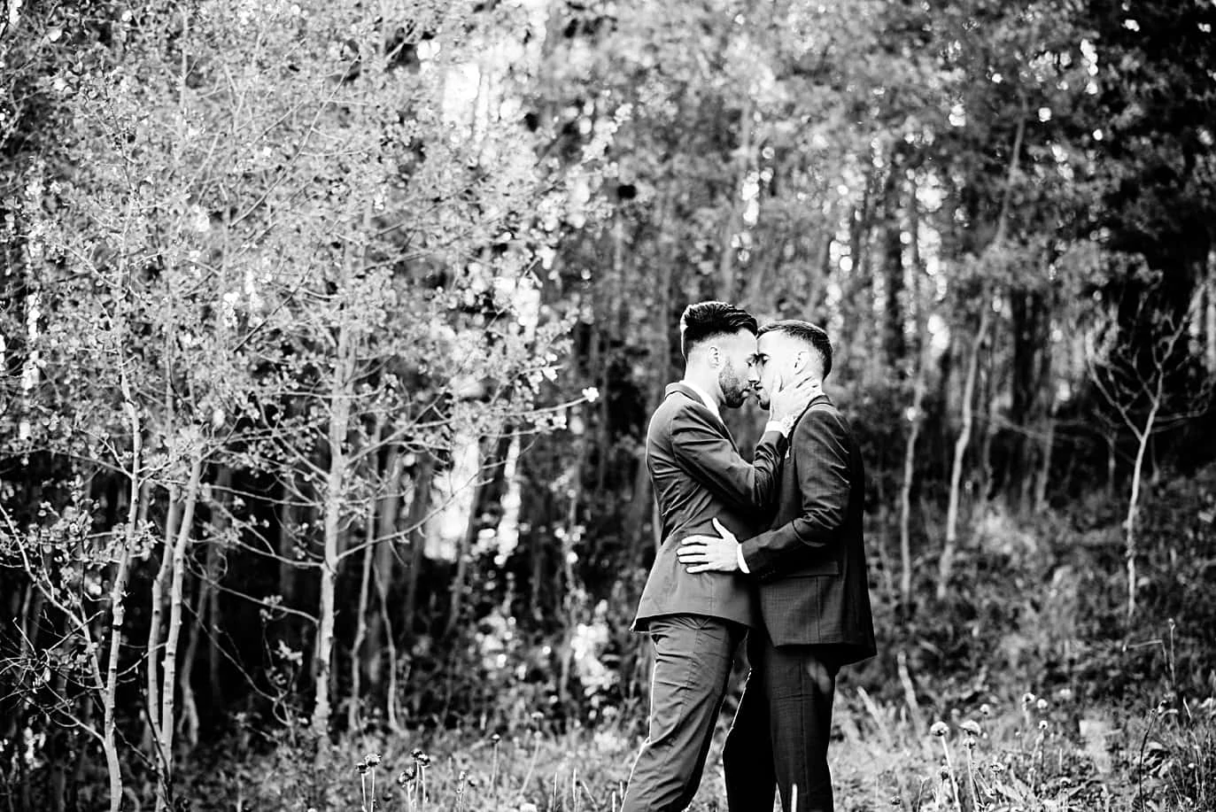 intimate moment between two grooms at Breckenridge Elopement by Colorado gay wedding photographer Jennie Crate