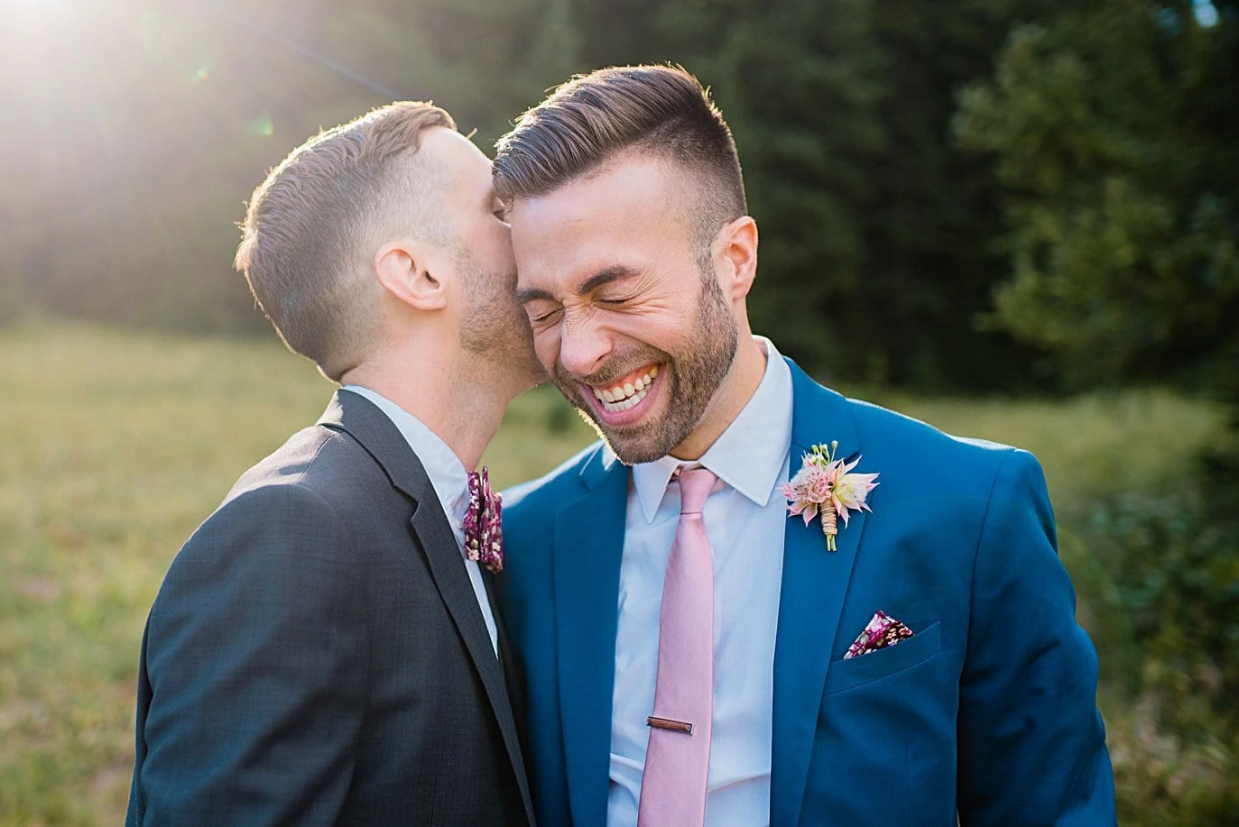 grooms laughing together at Breckenridge Elopement by Colorado gay wedding photographer Jennie Crate