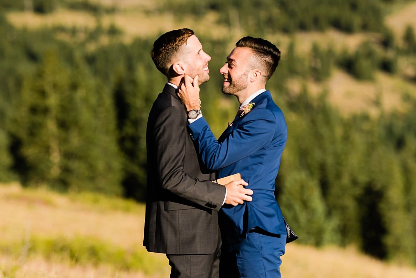 two groom share moment during self-solemnized ceremony at Breckenridge Elopement by Colorado gay wedding photographer Jennie Crate