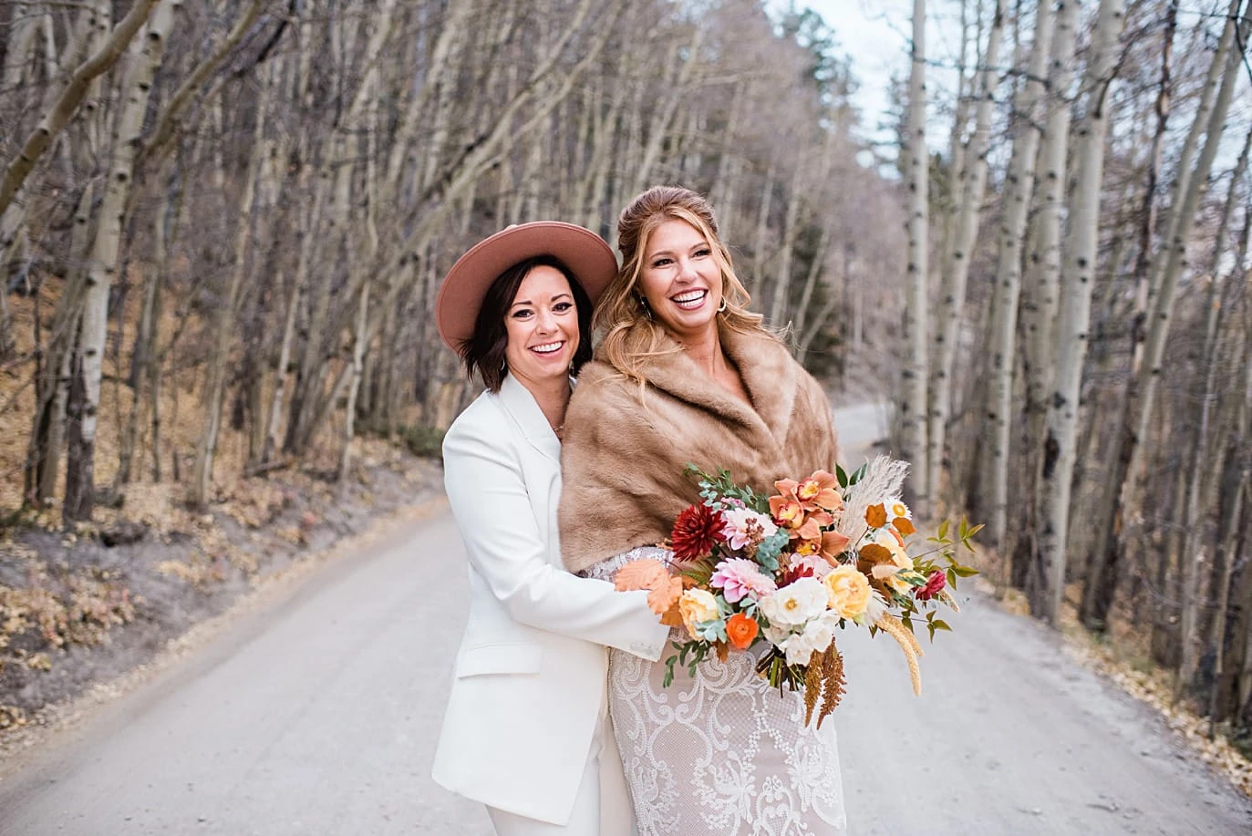 two brides along Boreas Pass road at Breckenridge microwedding by Breckenridge wedding photographer Jennie Crate