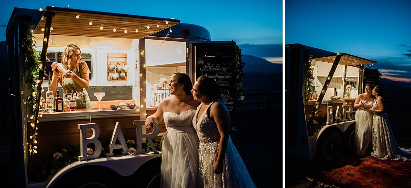 brides grabbing a drink at outdoor bar at Broken Antler Ranch wedding