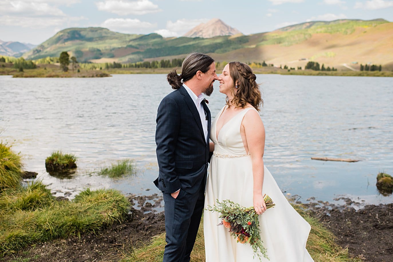 bride and groom cuddle after first look at Crested Butte Elopement by Crested Butte elopement photographer Jennie Crate