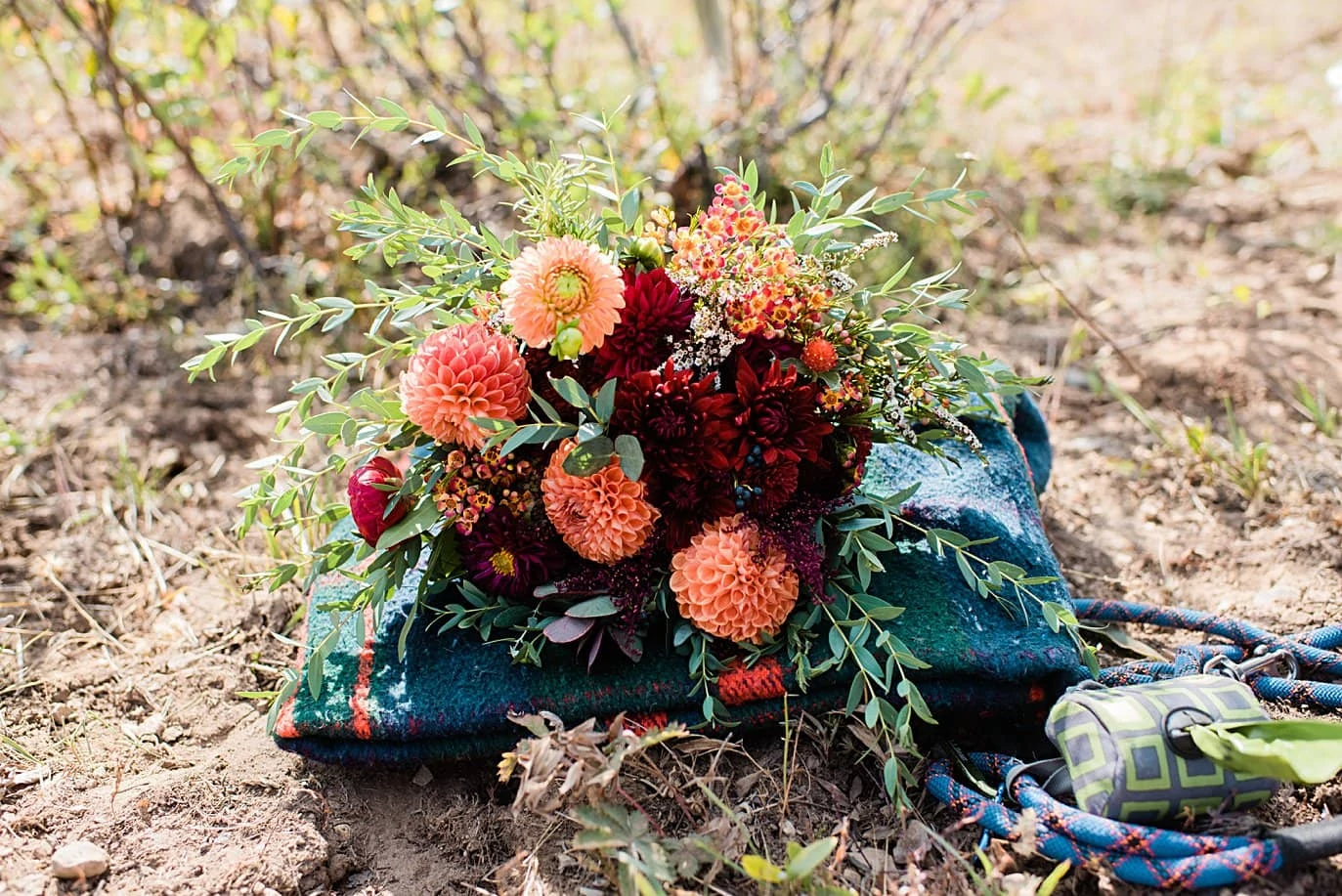 fall bridal bouquet with dahlias and picnic blanket