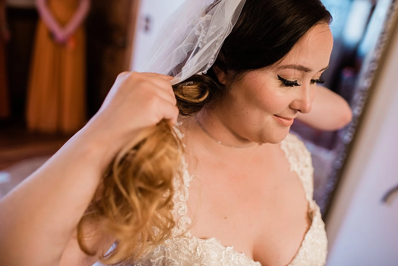 bride gets ready in barn at Deer Creek Valley ranch wedding by Conifer wedding photographer Jennie Crate