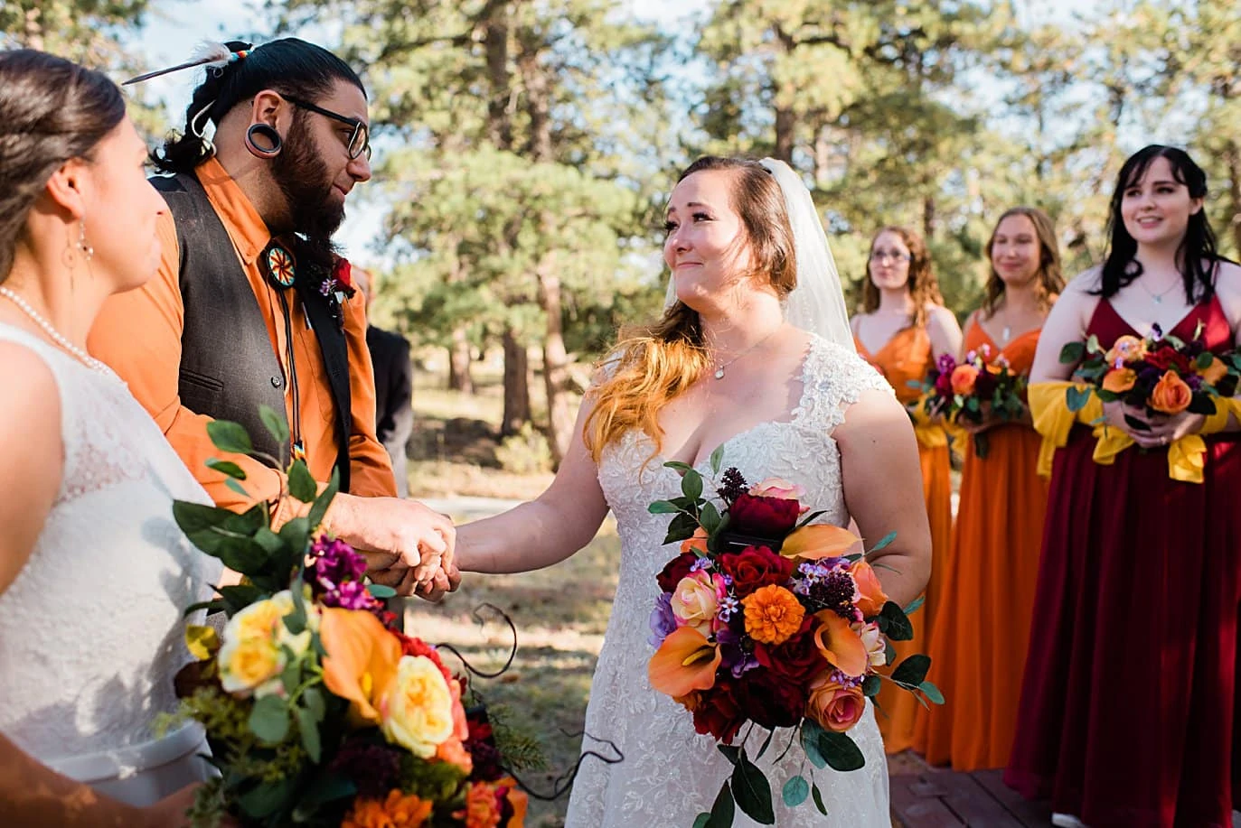 emotional handoff at end of aisle at fall Deer Creek Valley Ranch wedding by Denver wedding photographer Jennie Crate