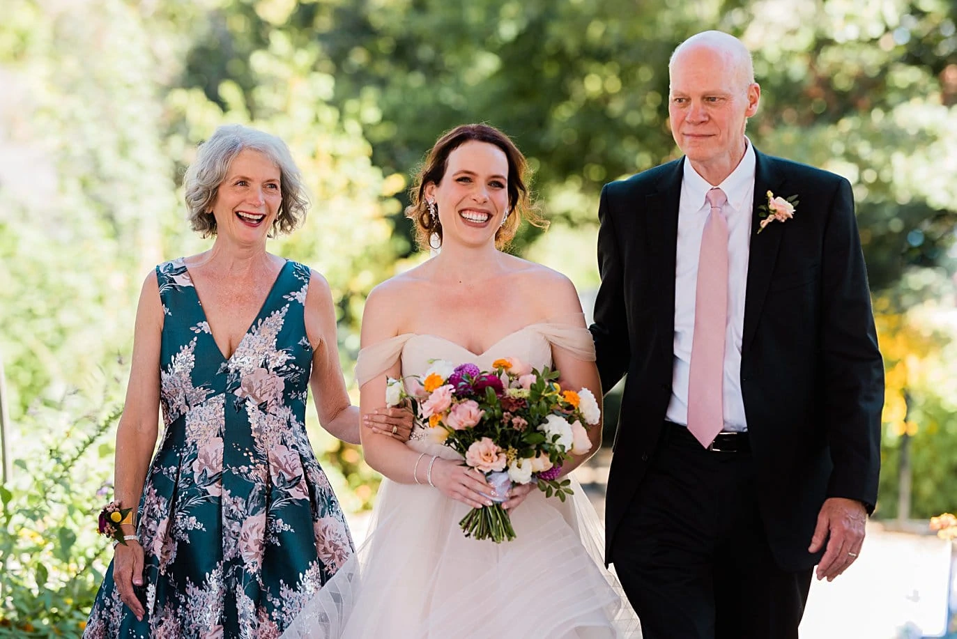 bride walks down aisle with parents at Denver Botanic Gardens microwedding by Denver wedding photographer Jennie Crate