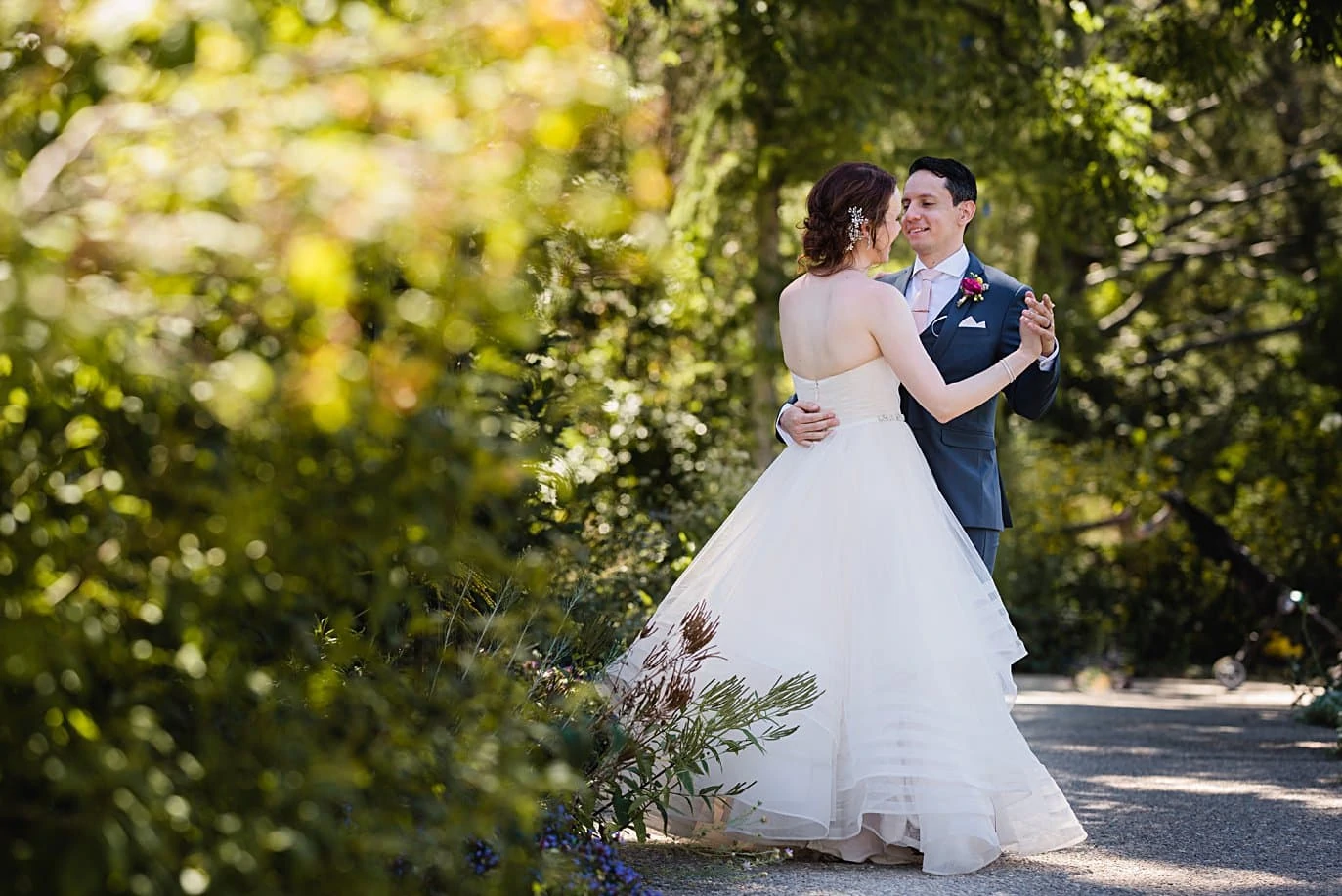 bride and groom practice first dance at Denver Botanic Gardens microwedding by Boulder wedding photographer Jennie Crate