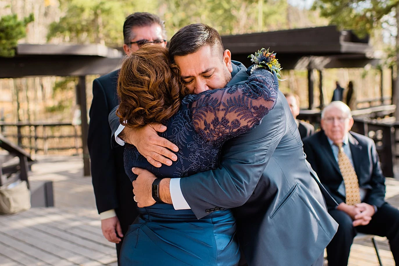 groom hugs mom at Golden Gate Canyon wedding by Golden wedding photographer Jennie Crate