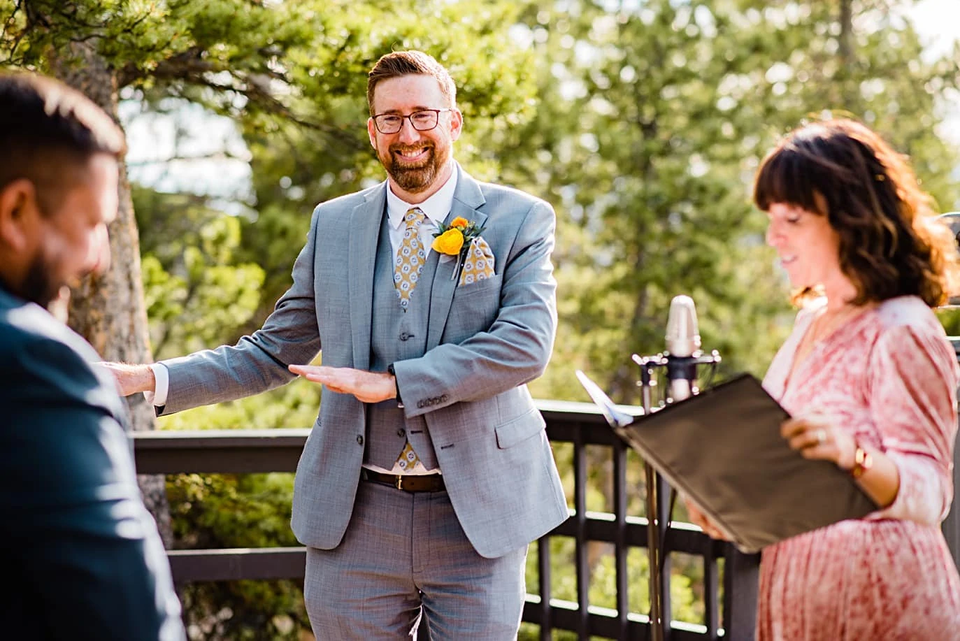 groom dances during vows at LGBT Golden Gate Canyon microwedding by Golden wedding photographer Jennie Crate