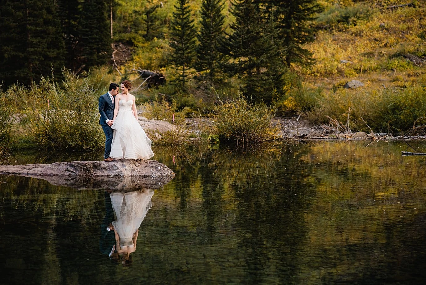 bride and groom reflection shot on Maroon Lake in Aspen by Denver wedding photographer Jennie Crate