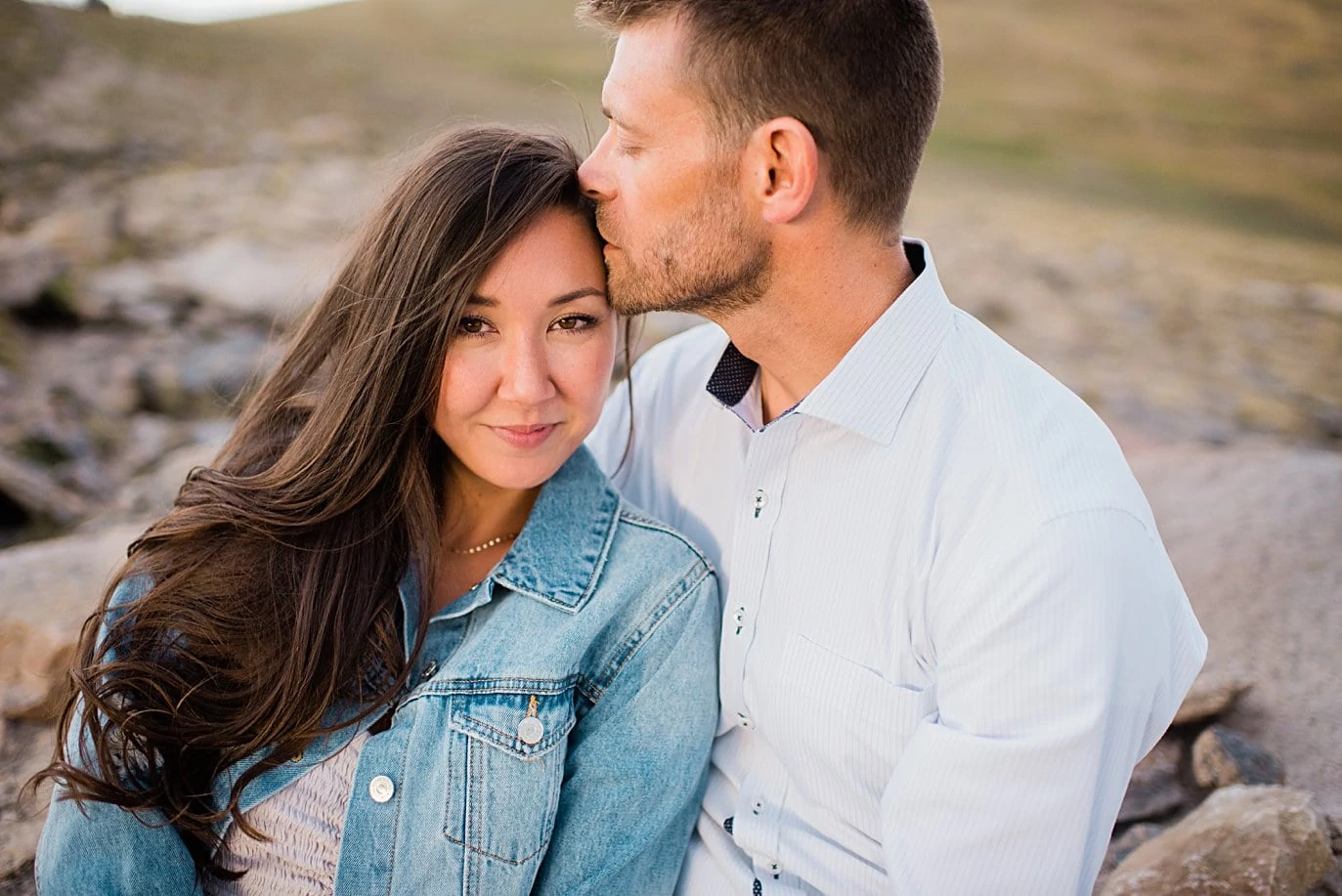 bride in pink dress and denim jacket summer trail ridge road engagement session by RMNP engagement photographer Jennie Crate