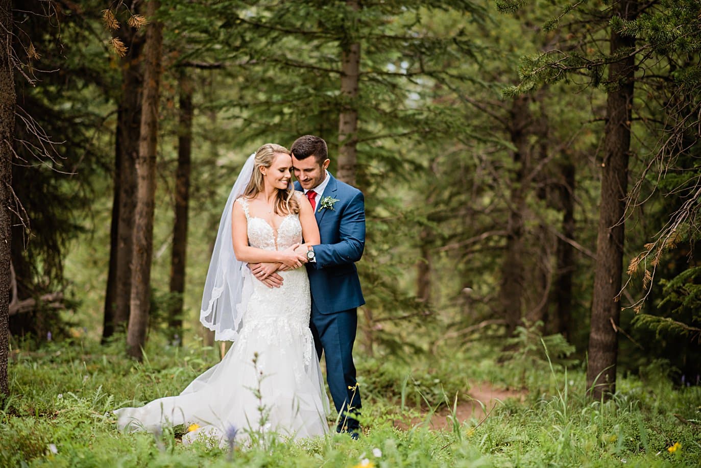 intimate bride and groom portrait at Vail Manor Lodge wedding by Breckenridge wedding photographer Jennie Crate