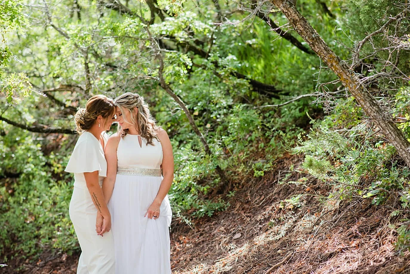 two brides intimate moment during bayfield wedding and elopement