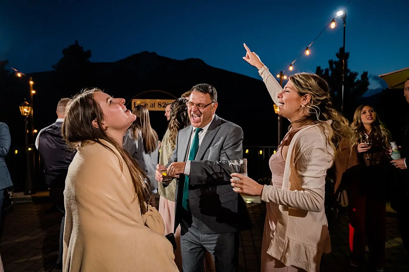 Outdoor dancing under the market lights at Della Terra Mountain Chateau wedding