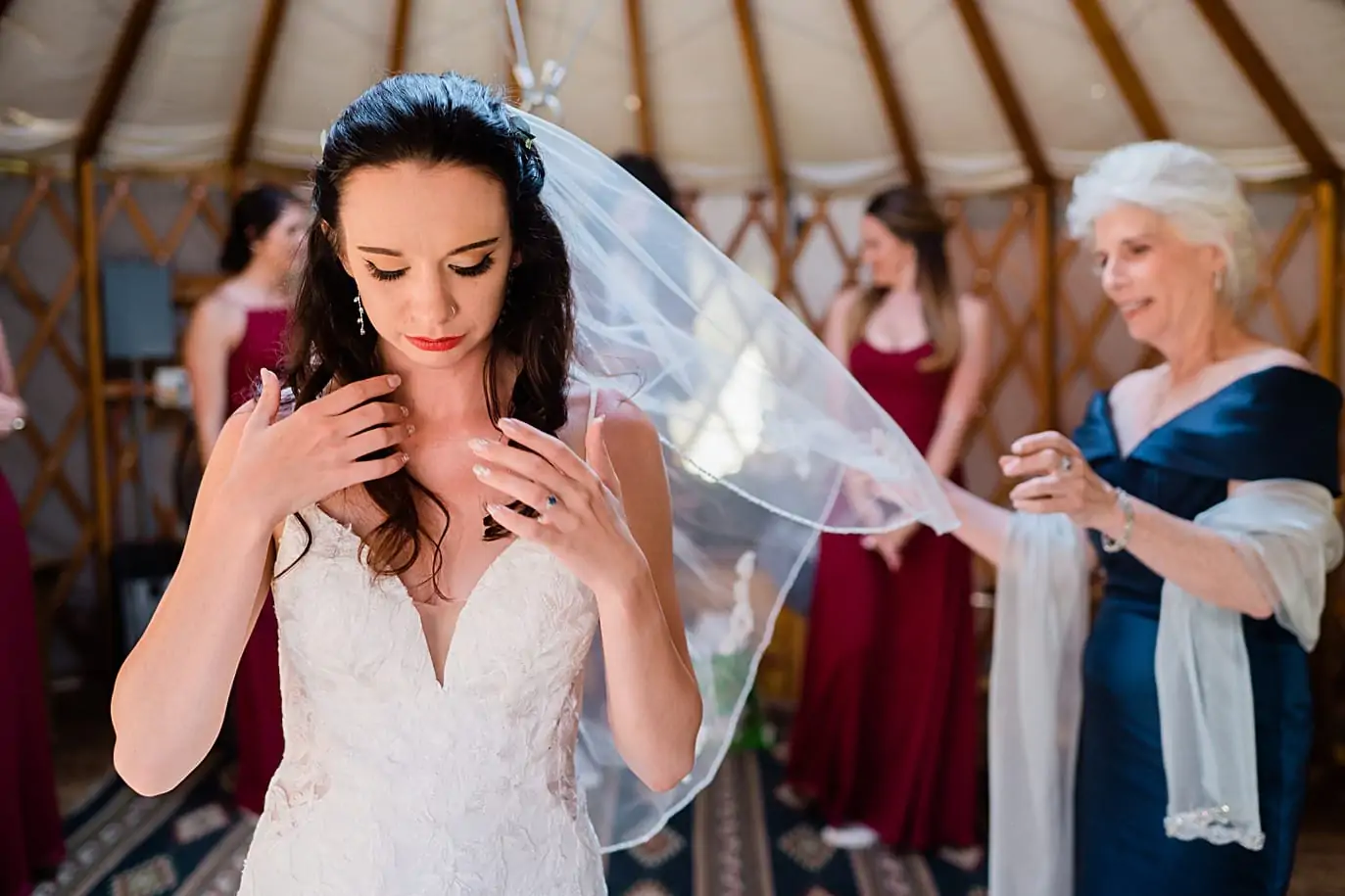 bride gets her veil on in the mountaintop yurt right before her mountaintop ceremonu