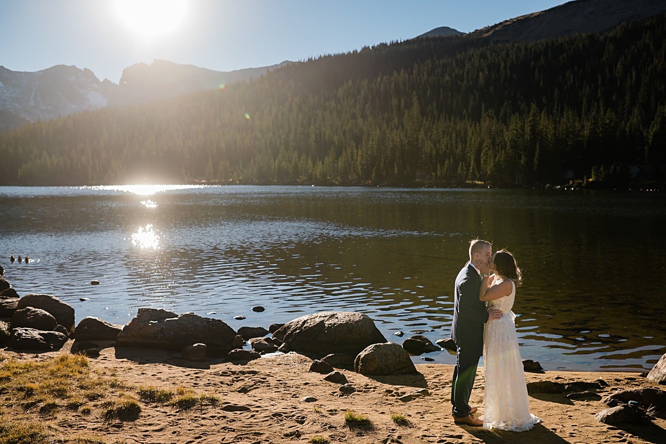bride and groom share first dance on the shores of their Long Lake elopement